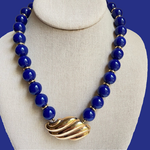 Avon vintage necklace with blue acrylic beads and attached goldtone pendant